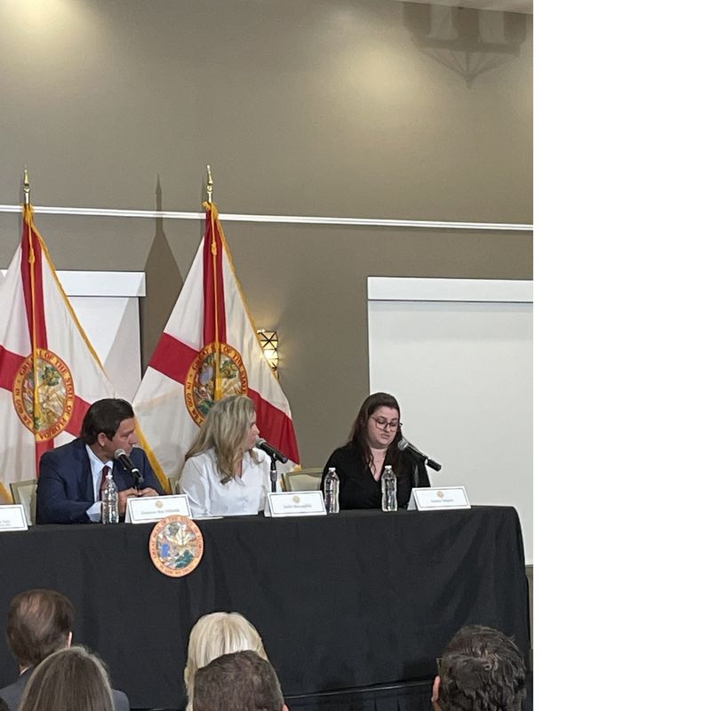 Gov. Ron DeSantis listens to Leanne Yehnert (far right) talk about how she's struggling with the cost of living in her new home in Brevard. She and her mother, Jackie McLaughlin, participated in a discussion Monday about eliminating homestead property taxes. The event was held at the Space Coast Association of Realtors in Melbourne.