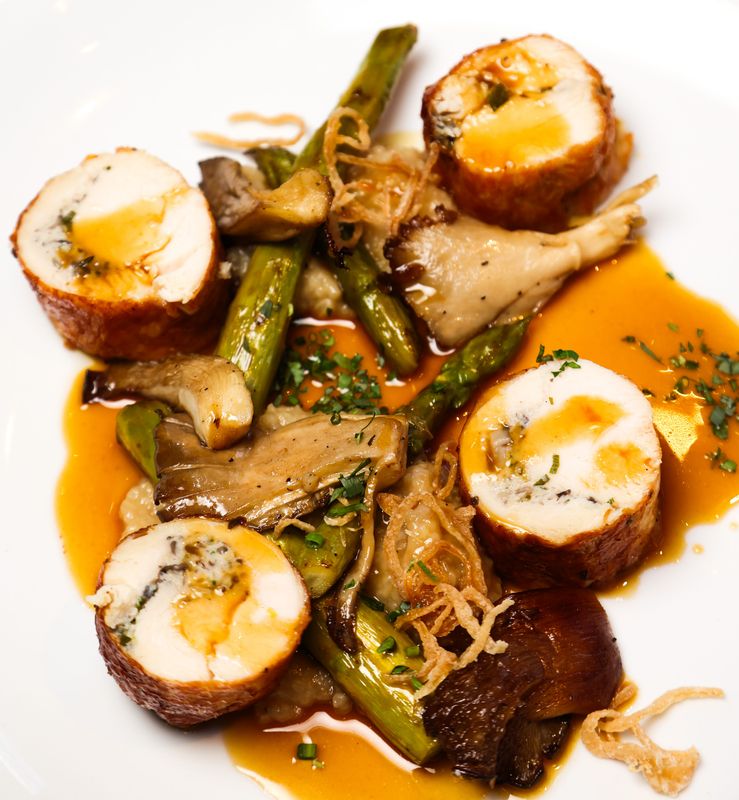 Among the signature dishes at Oxford Place is Chicken Ballotine: Chicken with local mushrooms, masala jus, grilled asparagus and crispy shallots.
