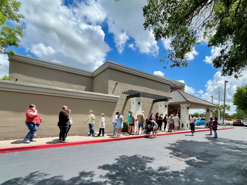 Customers line up during lunchtime on Tuesday, May 19, for the soft reopening of Sweet Tomatoes in Fort Myers.