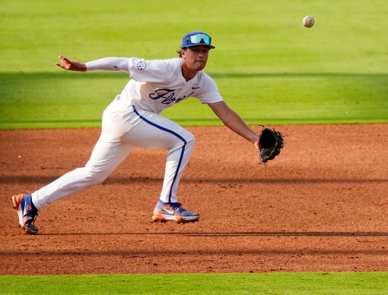 May 20, 2025; Hoover, AL, USA; Florida third baseman Landon Stripling (13) chases a ball hit between third and short during the game with South Carolina in the first round of the SEC Baseball Tournament at the Hoover Met.