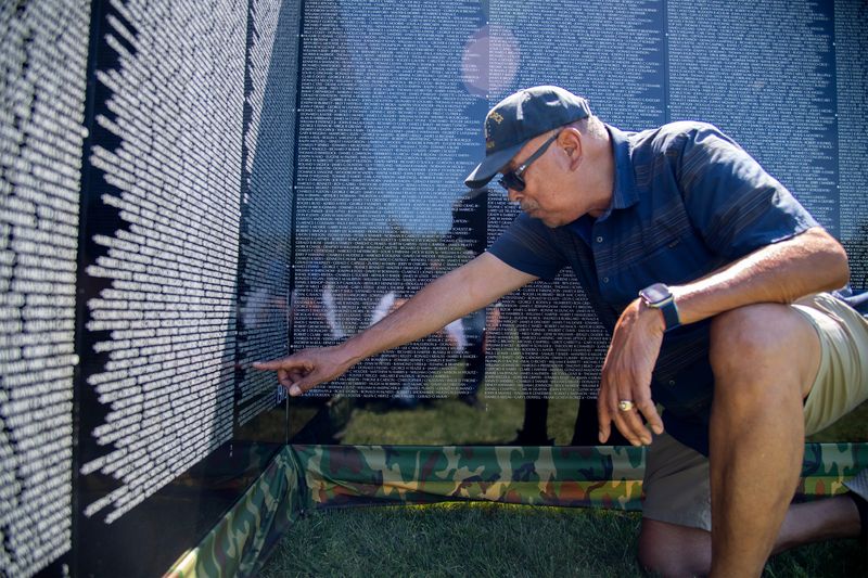 Vietnam veteran Rick Caccam looks for the names of fallen comrades on the Moving Wall at the Weber Point Events Center in downtown Stockton on May, 14, 2026. The wall is a traveling half-scale replica of the Vietnam Veterans Memorial in Washington D.C. and will be on display in Stockton to the public until Monday, May 18.