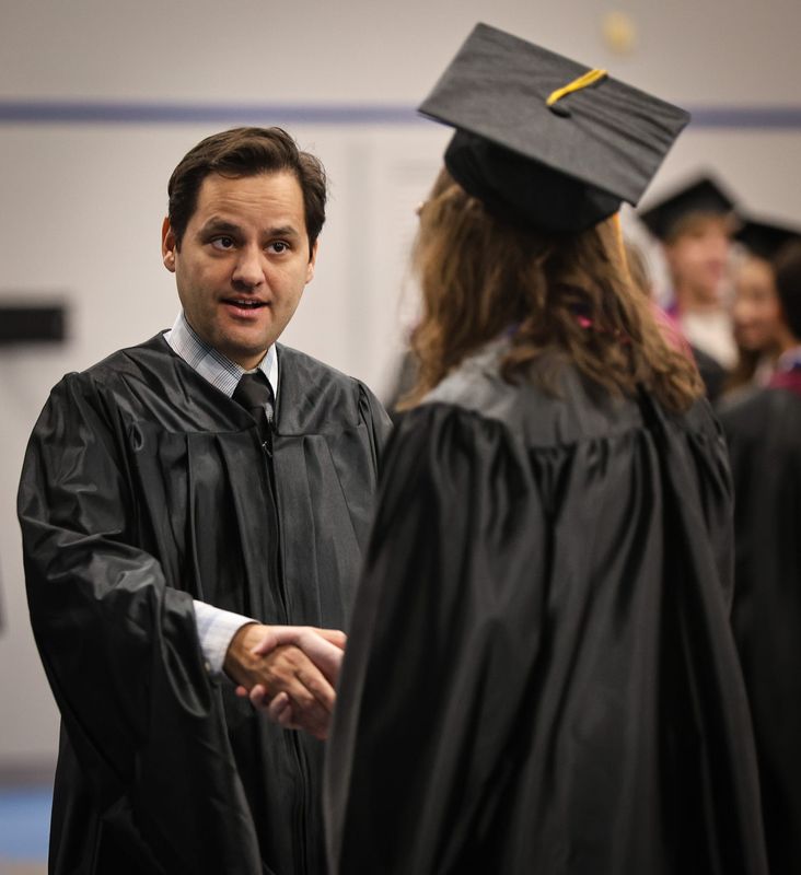 Harrison School of the Arts Principal Gian Monacelli congratulates a graduate at the school's commencement at the RP Funding Center, Monday, May 18, 2026, in Lakeland, Florida.