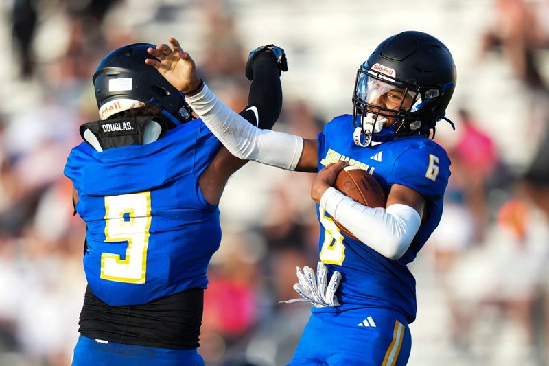 John Carrol Cathloic’s Kameron Barber (6) celbrates after making an interception against South Fork during a spring football game on Tuesday, May 19, 2026, at South Fork High School in Martin County.