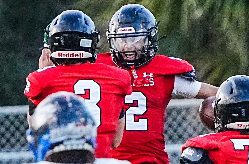 Tim Sedaros of Palm Bay celebrates his interception for a touchdown against Sebastian River with teammate Mikkel Zades May 19, 2026. Craig Bailey/FLORIDA TODAY via USA TODAY NETWORK