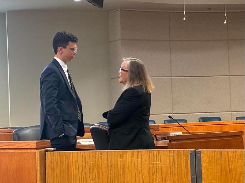 Assistant State Attorney Adam Smith and defense lawyer Laurie Hall talk before a bond hearing held May 20, 2026, at the Marion County Judicial Center.