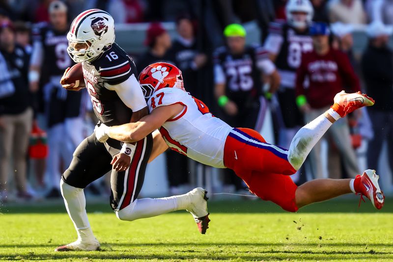 Nov 29, 2025; Columbia, South Carolina, USA; South Carolina Gamecocks quarterback Lanorris Sellers (16) is brought down by Clemson Tigers linebacker Sammy Brown (47) in the second quarter at Williams-Brice Stadium. Mandatory Credit: Jeff Blake-Imagn Images