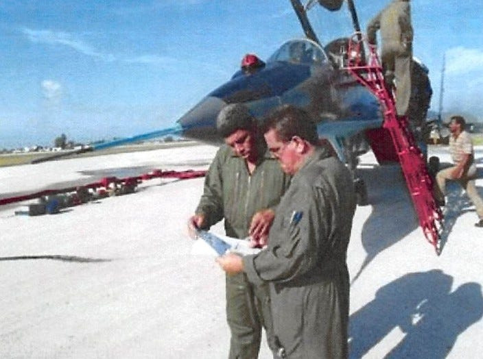 This undated photo shot in front of a Cuban jet fighter was included in a Jacksonville federal grand jury's 2025 indictment of Luis Raul Gonzalez-Pardo Rodriguez (left).