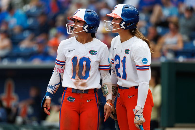 May 17, 2026; Gainesville, FL, USA; Florida Gators infielder Gabi Comia (10) and Florida Gators outfielder Taylor Shumaker (21) look on against the Georgia Tech Yellow Jackets during the fifth inning at Katie Seashole Pressly Stadium. Mandatory Credit: Matt Pendleton-Imagn Images