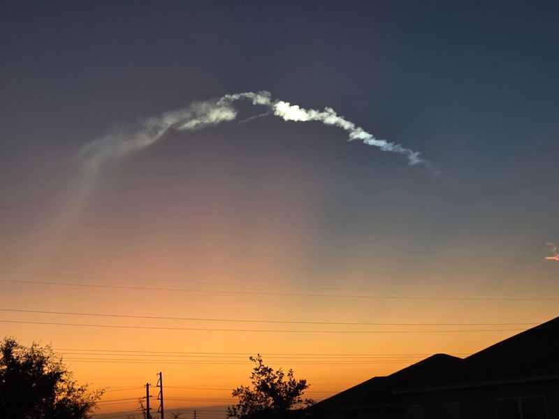 Shown is the view of a SpaceX Falcon 9 rocket carrying 29 Starlink broadband satellites into low-Earth orbit from Clermont, Florida, about 25 miles from Orlando. The rocket launched at 6:04 a.m. Thursday, May 21, 2026, from Cape Canaveral Space Force Station.