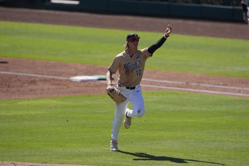 UCF first baseman Landon Moran celebrates after making a diving grab in the second inning of the Big 12 conference tournament quarterfinal against Oklahoma State at Surprise Stadium in Surprise, Arizona on Thursday, May 21, 2026.