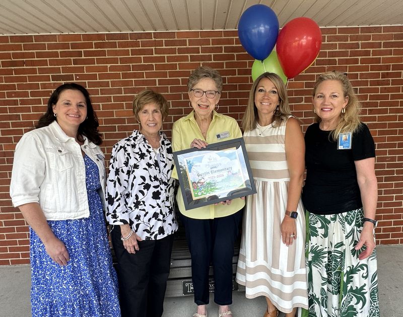 Members of the Children in Crisis board of directors stopped by Destin Elementary School on May 21 to present them with a plaque for their contribution through the 'Change for Children' campaign. Standing from left is Principal Amy Morgan, Mary Jane Ross and Kitty Johnson with CIC, Assistant Principal Jessica Brown, and Alicia Duhon.