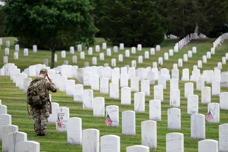 A soldier from the 3rd U.S. Infantry Regiment (The Old Guard) renders honors at a Medal of Honor Recipient’s gravesite at Arlington National Cemetery, Arlington, Virginia, Thursday, May 21, 2026.