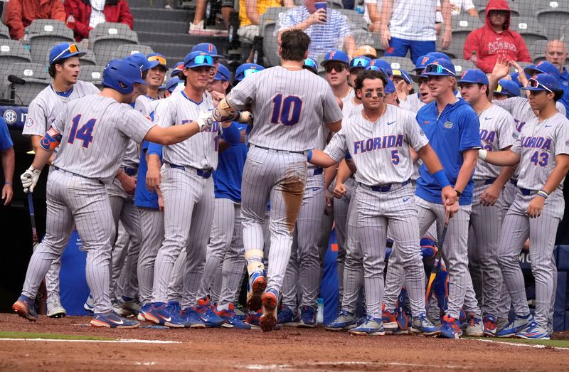 May 20, 2026; Hoover, AL, USA; Florida batter Ethan Surowiec is greeted by teammates after hitting a solo homer in the SEC Tournament game between Florida and Alabama at the Hoover Met.