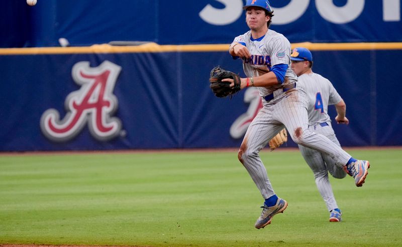 May 20, 2026; Hoover, AL, USA; Florida shortstop Brendan Lawson makes a play up the middle and throws to first for an out in the SEC Tournament game between Florida and Alabama at the Hoover Met.
