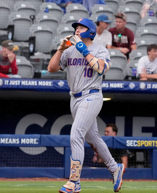 May 20, 2026; Hoover, AL, USA; Florida batter Ethan Surowiec celebrates as he rounds third after hitting a solo homer in the SEC Tournament game between Florida and Alabama at the Hoover Met.