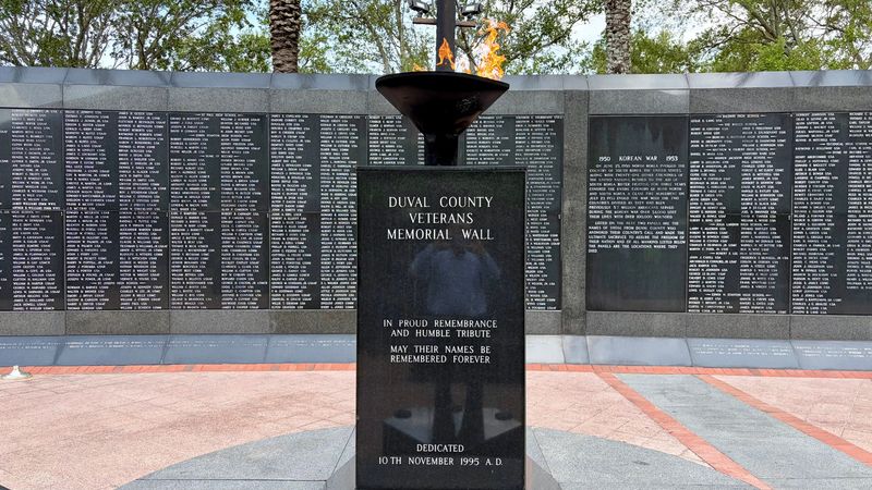 The eternal flame burns May 22, 2026 at Jacksonville Veterans Memorial Wall in the sports complex in downtown Jacksonville, Fla.