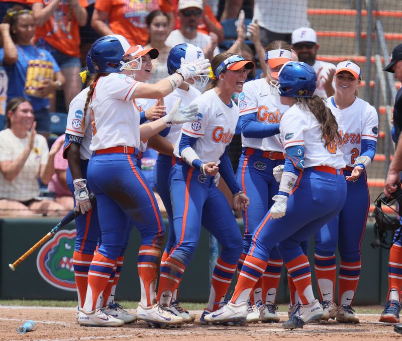Florida celebrates a late home run against Texas Tech during the super regional game of the NCAA Division 1 softball championship at Katie Seashole Pressly Stadium in Gainesville, FL on Friday, May 22, 2026. [Alan Youngblood/Gainesville Sun]