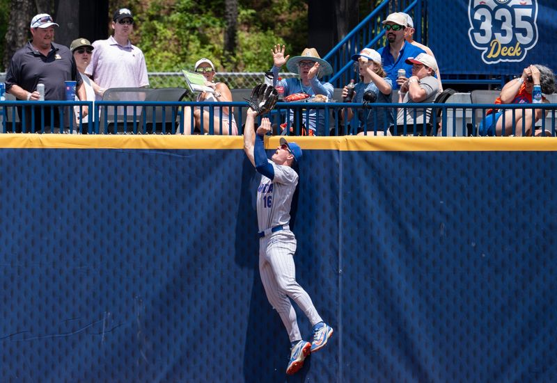 Florida Gators' Hayden Yost (16) robs a home run at the outfield wall as Georgia Bulldogs take on Florida Gators during the SEC baseball tournament at Hoover Metropolitan Stadium in Hoover, Ala. on Saturday, May 23, 2026.