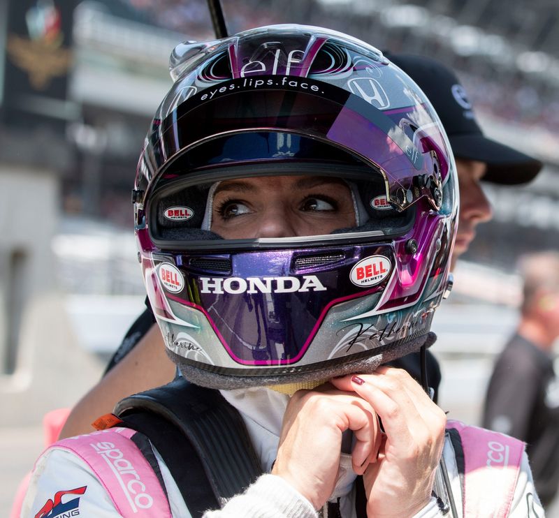 Dale Coyne Racing with RWR driver Katherine Legge (51) takes off her helmet Sunday, May 19, 2024, during practice ahead of qualifying for the 108th running of the Indianapolis 500 at Indianapolis Motor Speedway.