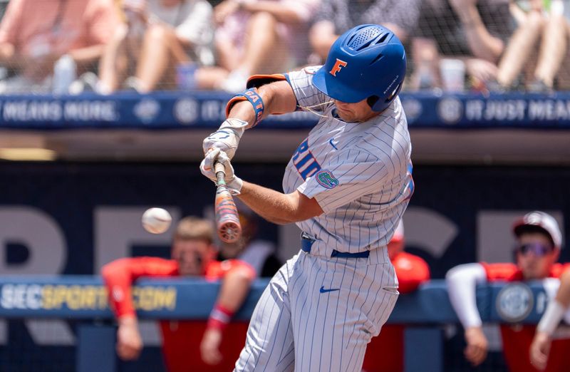 Florida Gators' Landon Stripling (13) hits the ball as Georgia Bulldogs take on Florida Gators during the SEC baseball tournament at Hoover Metropolitan Stadium in Hoover, Ala. on Saturday, May 23, 2026.