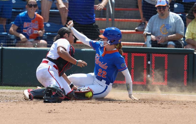 Florida outfielder Cassidy McLellan (22) steals home past Texas Tech catcher Lagi Quiroga (4) during game 2 of the super regional of the NCAA Division 1 softball championship at Katie Seashole Pressly Stadium in Gainesville, FL on Saturday, May 23, 2026. [Alan Youngblood/Gainesville Sun]