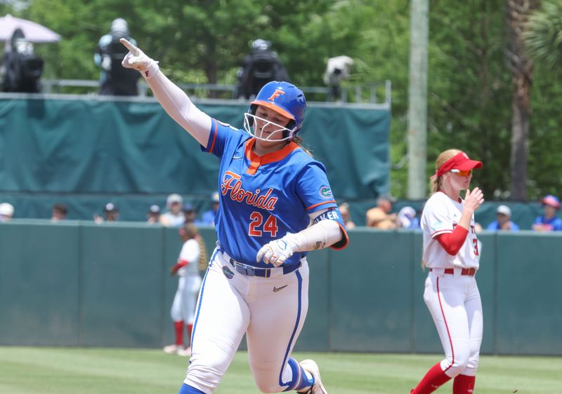 Florida infielder Madison Walker (24) celebrates a multiple run home run during game 2 of the super regional of the NCAA Division 1 softball championship at Katie Seashole Pressly Stadium in Gainesville, FL on Saturday, May 23, 2026. [Alan Youngblood/Gainesville Sun]