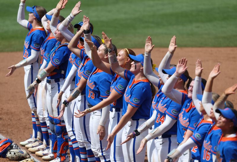 The Gator softball team gator chomps with with the Fans after their 10-2 win over Texas Tech in game 2 of the super regional of the NCAA Division 1 softball championship at Katie Seashole Pressly Stadium in Gainesville, FL on Saturday, May 23, 2026. [Alan Youngblood/Gainesville Sun]