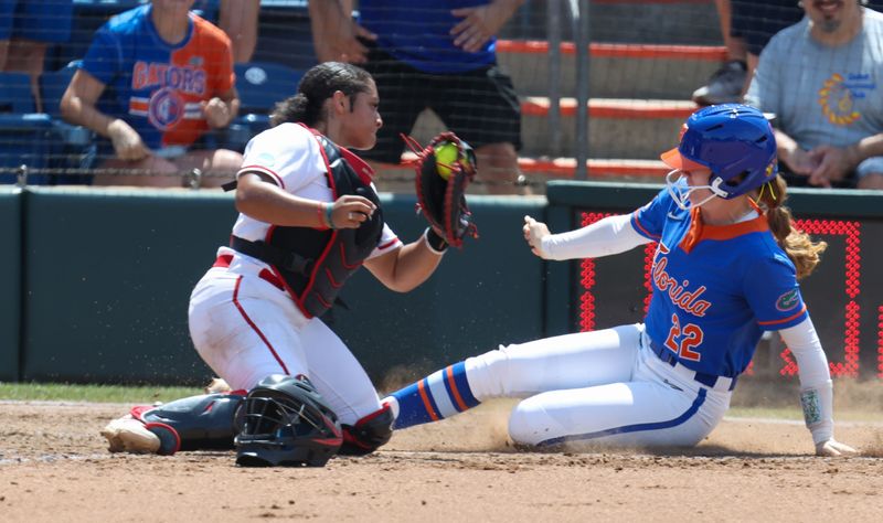 Florida outfielder Cassidy McLellan (22) steals home past Texas Tech catcher Lagi Quiroga (4) during game 2 of the super regional of the NCAA Division 1 softball championship at Katie Seashole Pressly Stadium in Gainesville, FL on Saturday, May 23, 2026. [Alan Youngblood/Gainesville Sun]