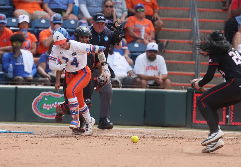 Florida catcher Ella Wesolowski (74) tries to beat the throw to first during game 3 of the super regional of the NCAA Division 1 softball championship at Katie Seashole Pressly Stadium in Gainesville, FL on Sunday, May 24, 2026. [Alan Youngblood/Gainesville Sun]