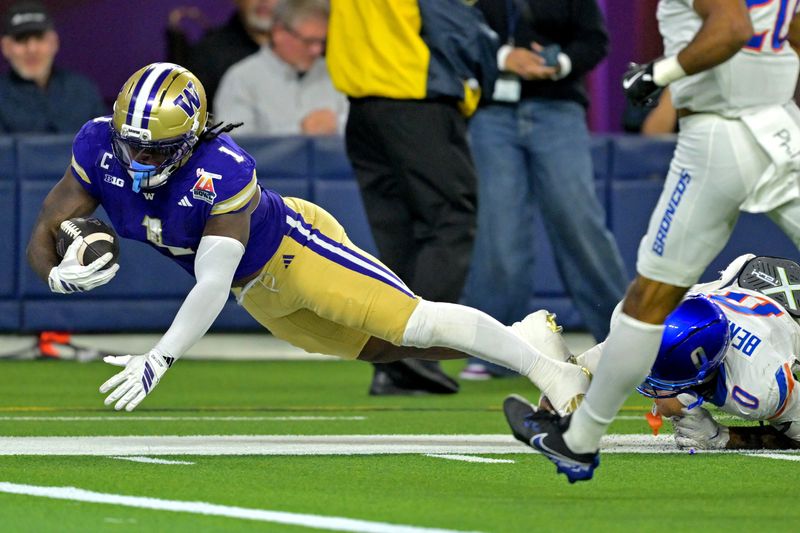 Dec 13, 2025; Inglewood, CA, USA; Washington Huskies running back Jonah Coleman (1) is stopped short of the goal line by Boise State Broncos defensive back Ty Benefield (0) in the first half of the LA Bowl at SoFi Stadium. Mandatory Credit: Jayne Kamin-Oncea-Imagn Images