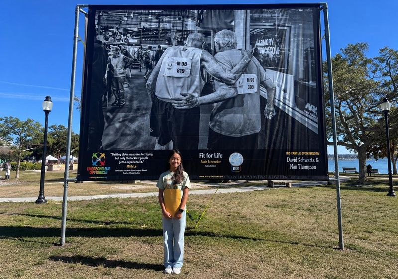 Minh Le, a Pine View School eighth-grader, with her award-winning quotation during Embracing Our Differences’ Grand Opening Celebration in January at Bayfront Park in Sarasota.