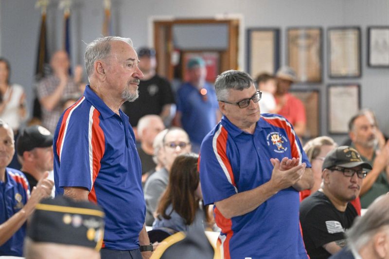 Veterans stand as their military branches are recognized during a Memorial Day Ceremony Monday at the American Legion Post 235 in Fort Walton Beach.