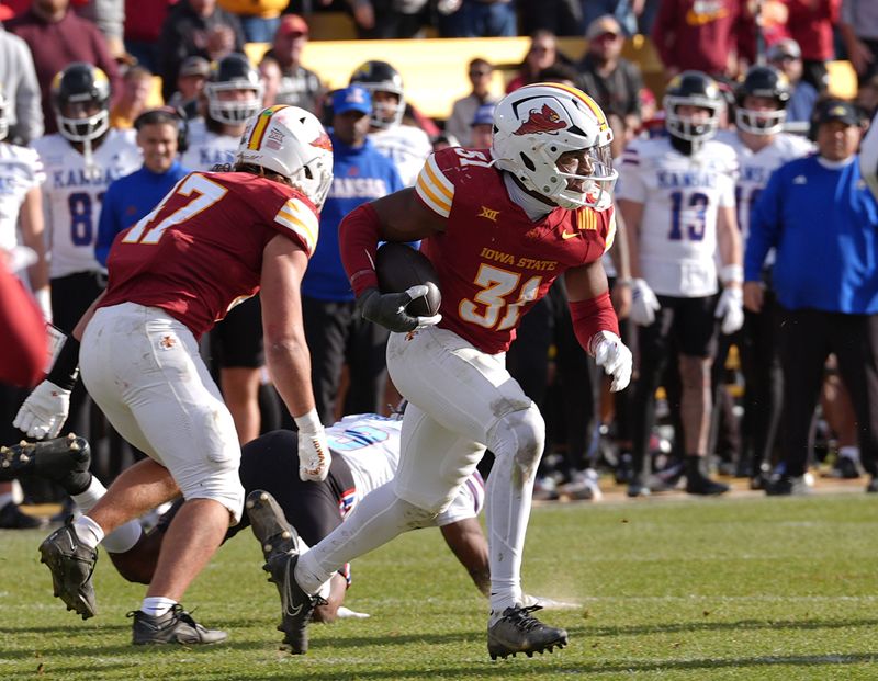 Iowa State Cyclones' defensive back Marcus Neal Jr.(31) runs with the ball after a interception against Kansas during the fourth quarter in the senior day on Nov. 22, 2025, at Jack Trice Stadium in Ames, Iowa