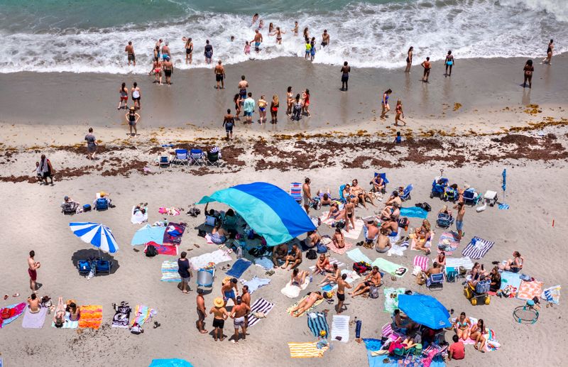 People fill the beach as they enjoy the Memorial Day holiday on May 25, 2026, in Juno Beach, Florida.