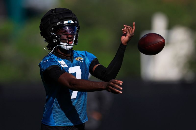 Jacksonville Jaguars wide receiver Brian Thomas Jr. (7) tosses the ball during the first day of an NFL football training camp practice Wednesday, July 24, 2024 at EverBank Stadiumâ€™s Miller Electric Center in Jacksonville, Fla.