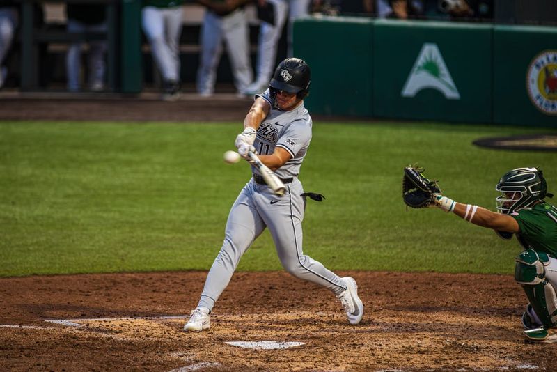 UCF's Andrew Williamson (11) connects with a pitch against Stetson on March 24, 2026, at Melching Field.