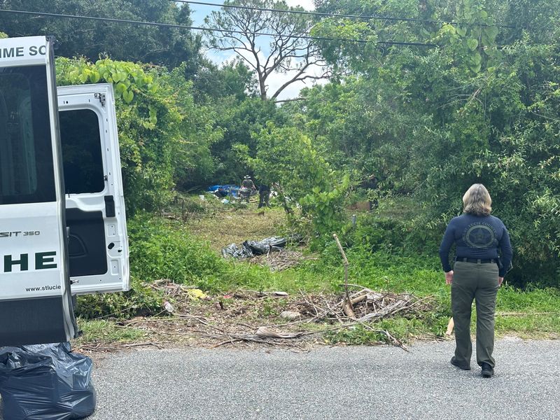 St. Lucie County sheriff's detectives investigate the area around a homeless tent encampment where a person was found dead inside a tent May 25 in the 2600 block of Rolyat Street. It is being investigated as a homicide.