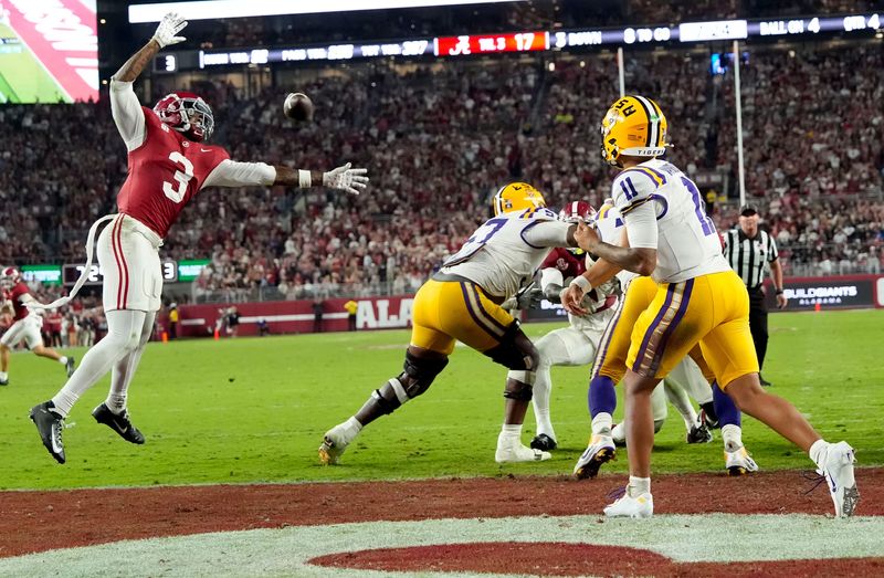 Nov 8, 2025; Tuscaloosa, Alabama, USA; LSU quarterback Michael Van Buren Jr. (11) threads a pass by Alabama defensive back Keon Sabb (3) at Saban Field at Bryant-Denny Stadium. Alabama defeated LSU 20-9. Mandatory Credit: Gary Cosby Jr.-Imagn Images