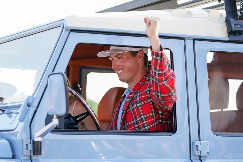 May 25, 2025; Fort Worth, Texas, USA; Ben Griffin is awarded with a 1992 Schwab Defender after winning the Charles Schwab Challenge golf tournament. Mandatory Credit: Raymond Carlin III-Imagn Images