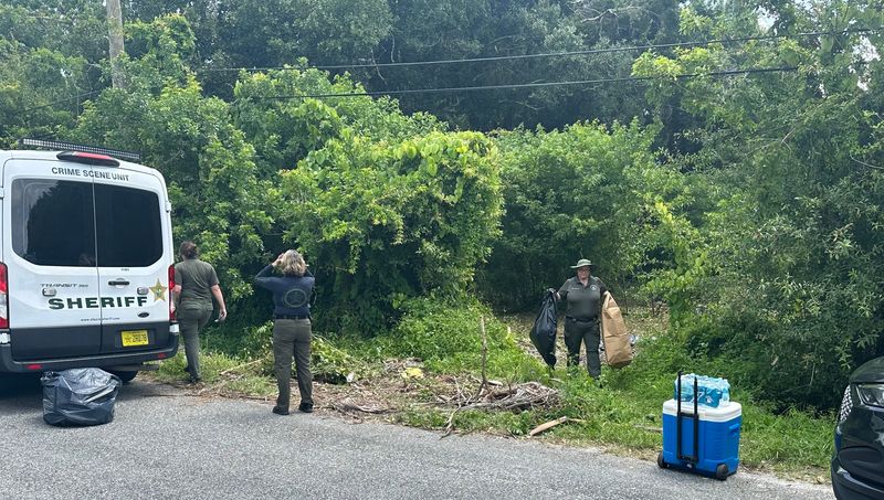 St. Lucie County sheriff's detectives investigate the area around a homeless tent encampment where a person was found dead inside a tent May 25 in the 2600 block of Rolyat Street. It is being investigated as a homicide.