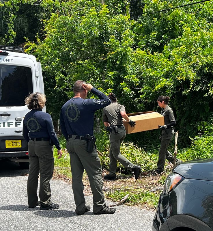 St. Lucie County sheriff's detectives investigate the area around a homeless tent encampment where a person was found dead inside a tent May 25 in the 2600 block of Rolyat Street. It is being investigated as a homicide.