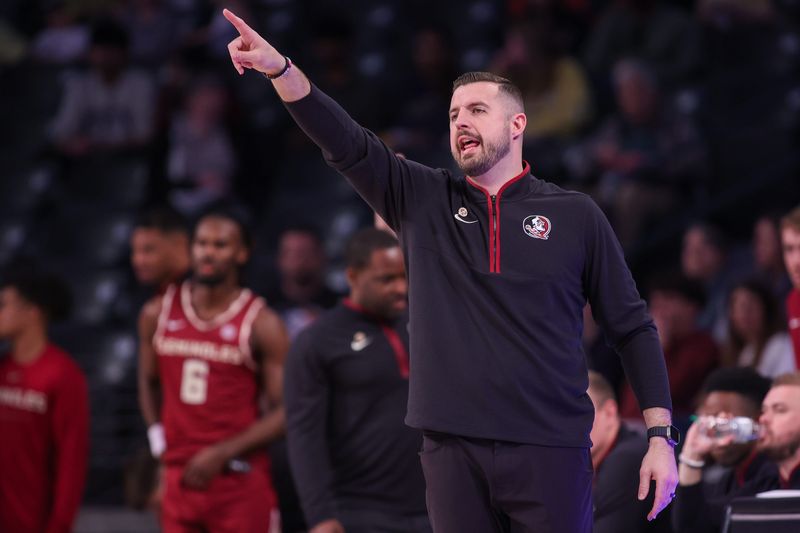 Feb 28, 2026; Atlanta, Georgia, USA; Florida State Seminoles head coach Luke Loucks calls a play against the Georgia Tech Yellow Jackets in the first half at McCamish Pavilion. Mandatory Credit: Brett Davis-Imagn Images