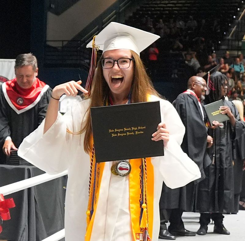 Graduates from New Smyrna Beach High School’s Class of 2026 celebrate as they cross the stage during commencement exercises May 28, 2026, at the Ocean Center in Daytona Beach.