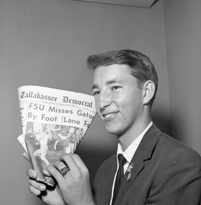 An FSU football fan shows the Tallahassee Democrat newspaper headline from 1966 focused on the controversial call in the end zone involving FSU player Lane Fenner. He was called out-of-bounds but the picture shows he was clearly inbounds.