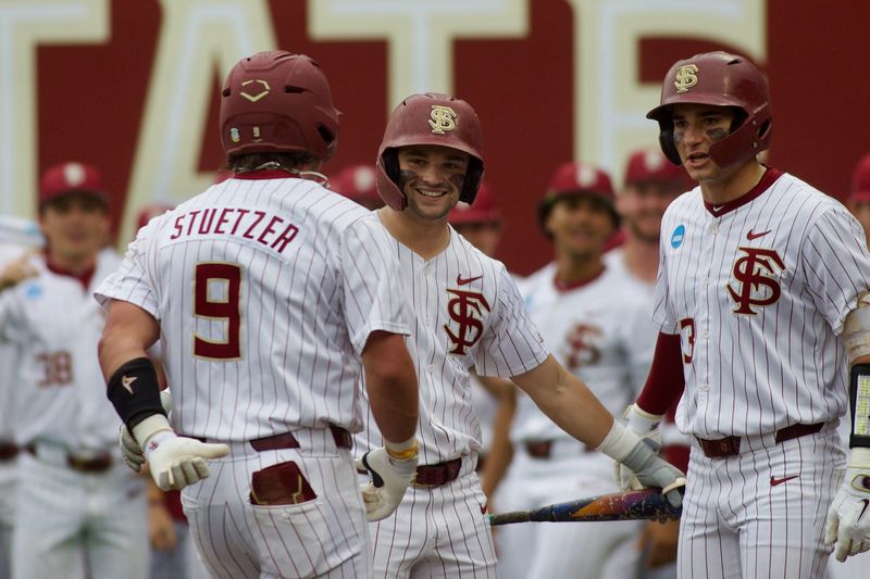 John Stuetzer celebrates a home run for FSU baseball with Brayden Dowd (Left) and Brody DeLamielleure (Right) as they host St. John’s in the NCAA Tallahassee Regional on Friday, May 29, 2026 at Dick Howser Stadium.