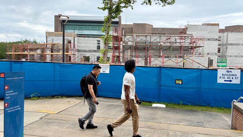 University of North Florida visitors attending a campus event on May 29, 2026 walks past the construction area for the Student Success Center, one of several campus improvements at UNF with support from the state.