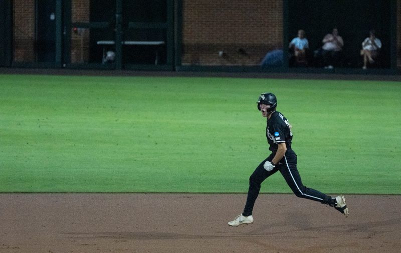 UCF Knights' Jordan Lodise (3) celebrates his home run as NC State Wolfpack take on UCF Knights during the NCAA Regional Baseball tournament at Plainsman Park in Auburn, Ala. on Friday, May 29, 2026.