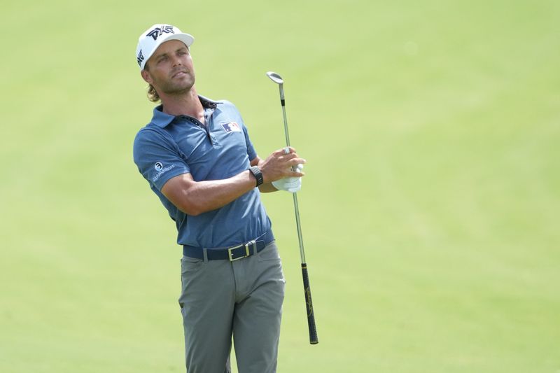 May 30, 2026; Fort Worth, Texas, USA; Eric Cole watches his shot from the 18th fairway during the third round of the Charles Schwab Challenge golf tournament. Mandatory Credit: Raymond Carlin III-Imagn Images