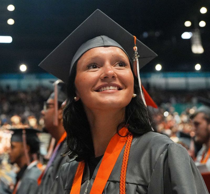 A University High School Class of 2026 grad is all smiles after turning her tassel, May 30, 2026, at the Ocean Center in Daytona Beach.