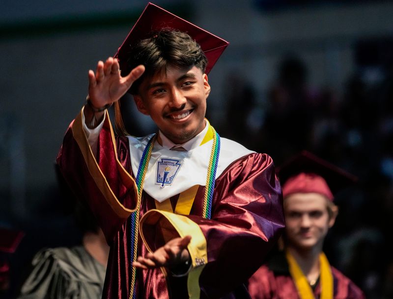 Edwin Jimenez-Medina reacts as he receives his diploma during the commencement ceremony for the Riverdale High School Class of 2026 at Suncoast Credit Union Arena in Fort Myers, Fla., on Saturday, May 30, 2026.